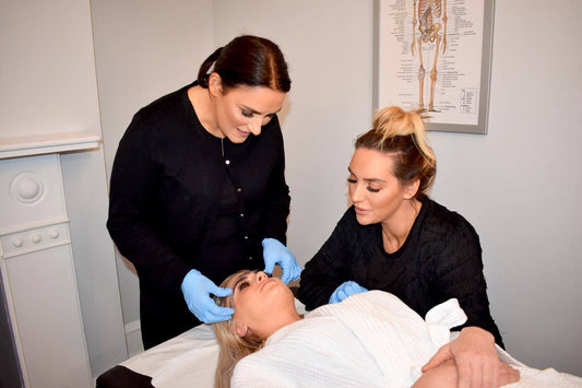 Tutor guiding student through a Microblading course